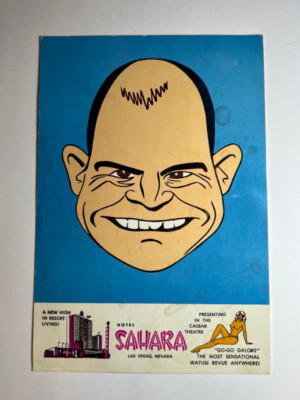 A historical Sahara promotional print with a smiling caricature on a blue background and Casbar Theatre advertising below.