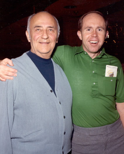 Johnny Moss and a younger Jack Binion standing together, with an arm around each other’s shoulders.