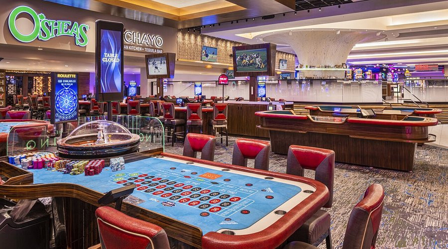 Gaming tables on the LINQ casino floor, with O’Sheas and Chayo signs behind them.