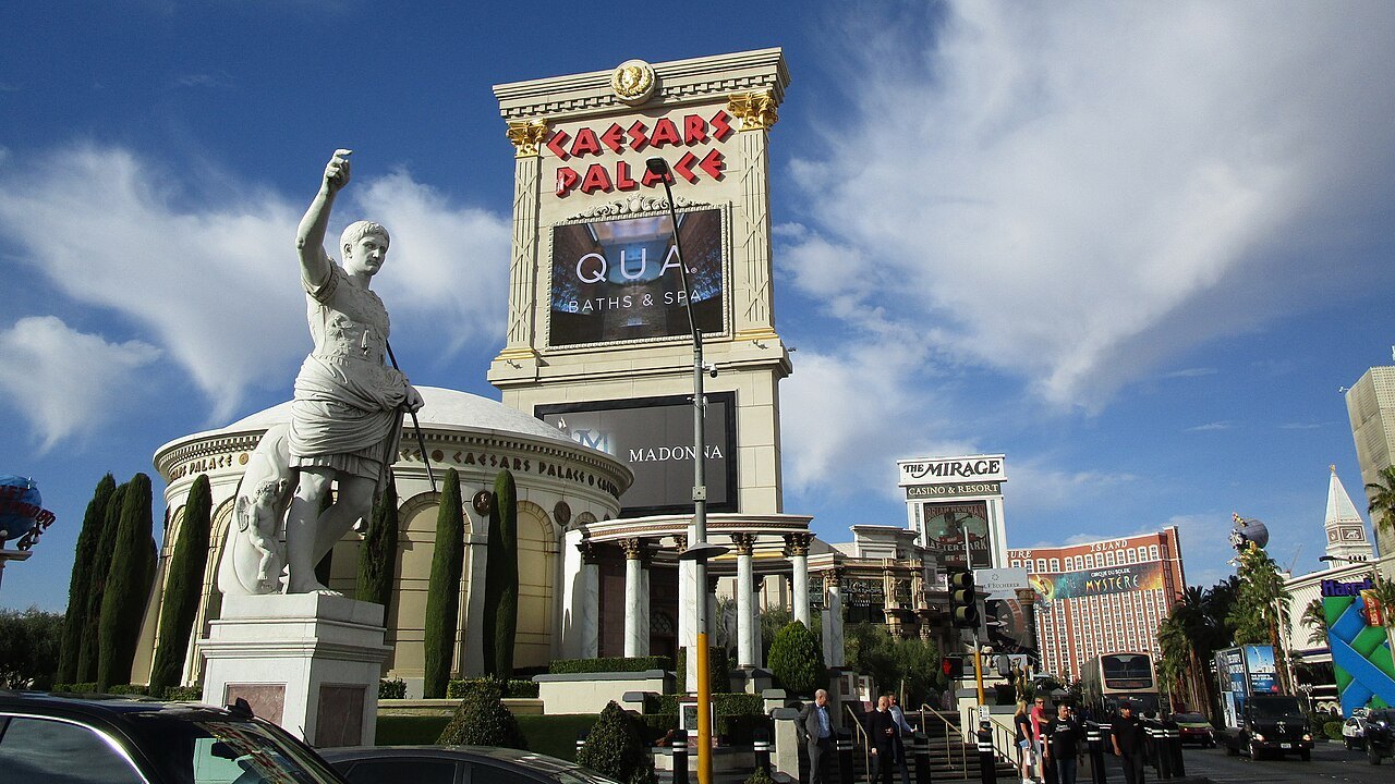 Older Augustus statue with a raised hand, one of the Caesars luck-touch figures.