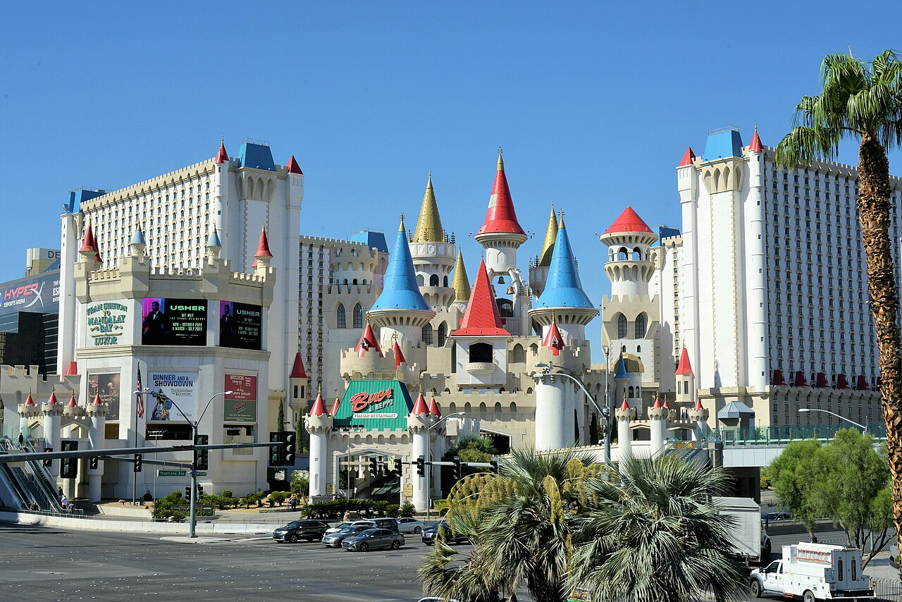 Excalibur castle exterior, August 2022; historical signage and banners.