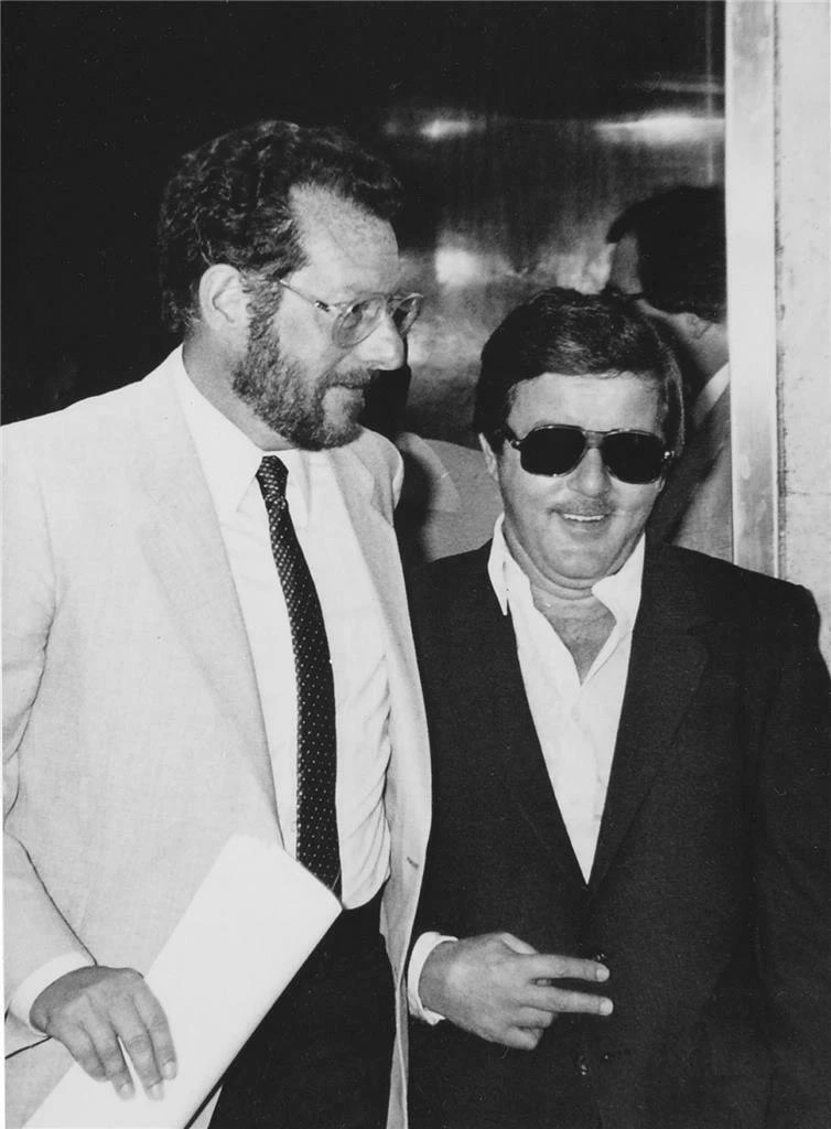 Historical photograph of two men in suits.