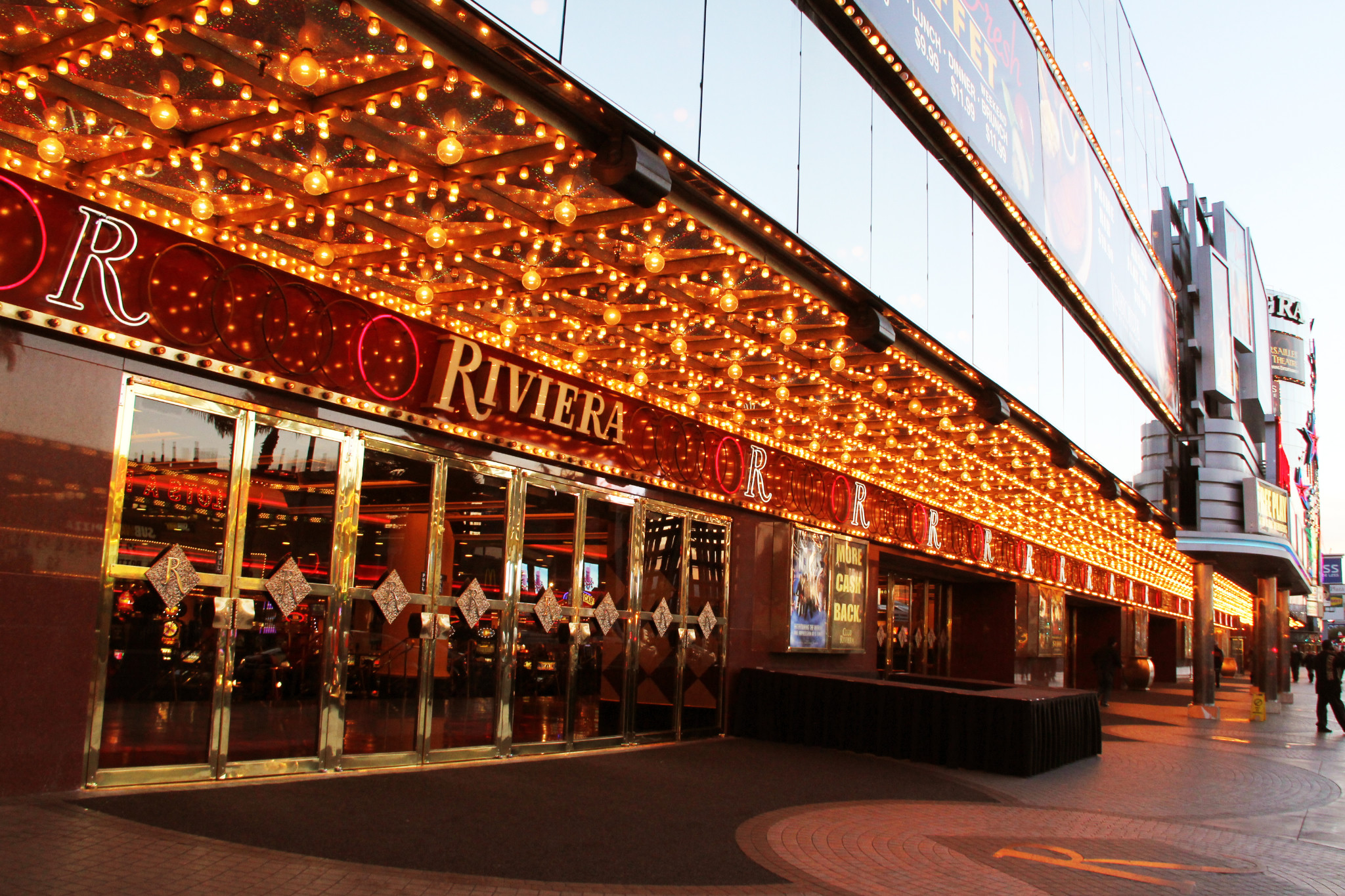 The Riviera’s illuminated entrance canopy and mirrored doors in a historical exterior photograph.