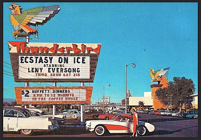 A historical colour view of the Thunderbird sign and roadside entrance, with period cars in front.