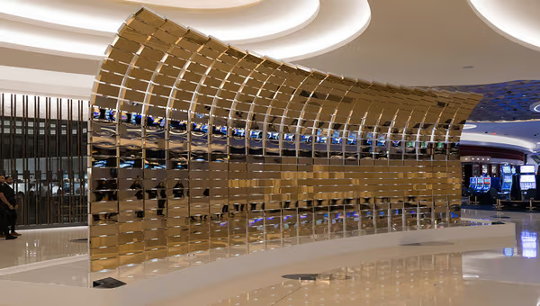 A gold reflective sculpture on the casino floor inside Fontainebleau Las Vegas.