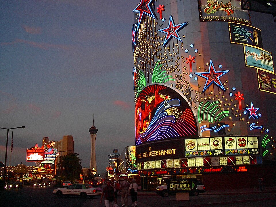 Historic Riviera neon frontage and Strip streetscape at dusk in 2003.
