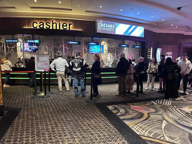 A casino cashier counter and customer queue.