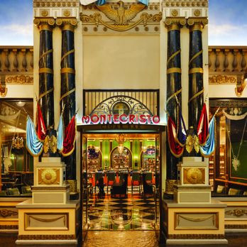 The ornate Montecristo entrance at Paris Las Vegas, with dark columns and coloured drapes.