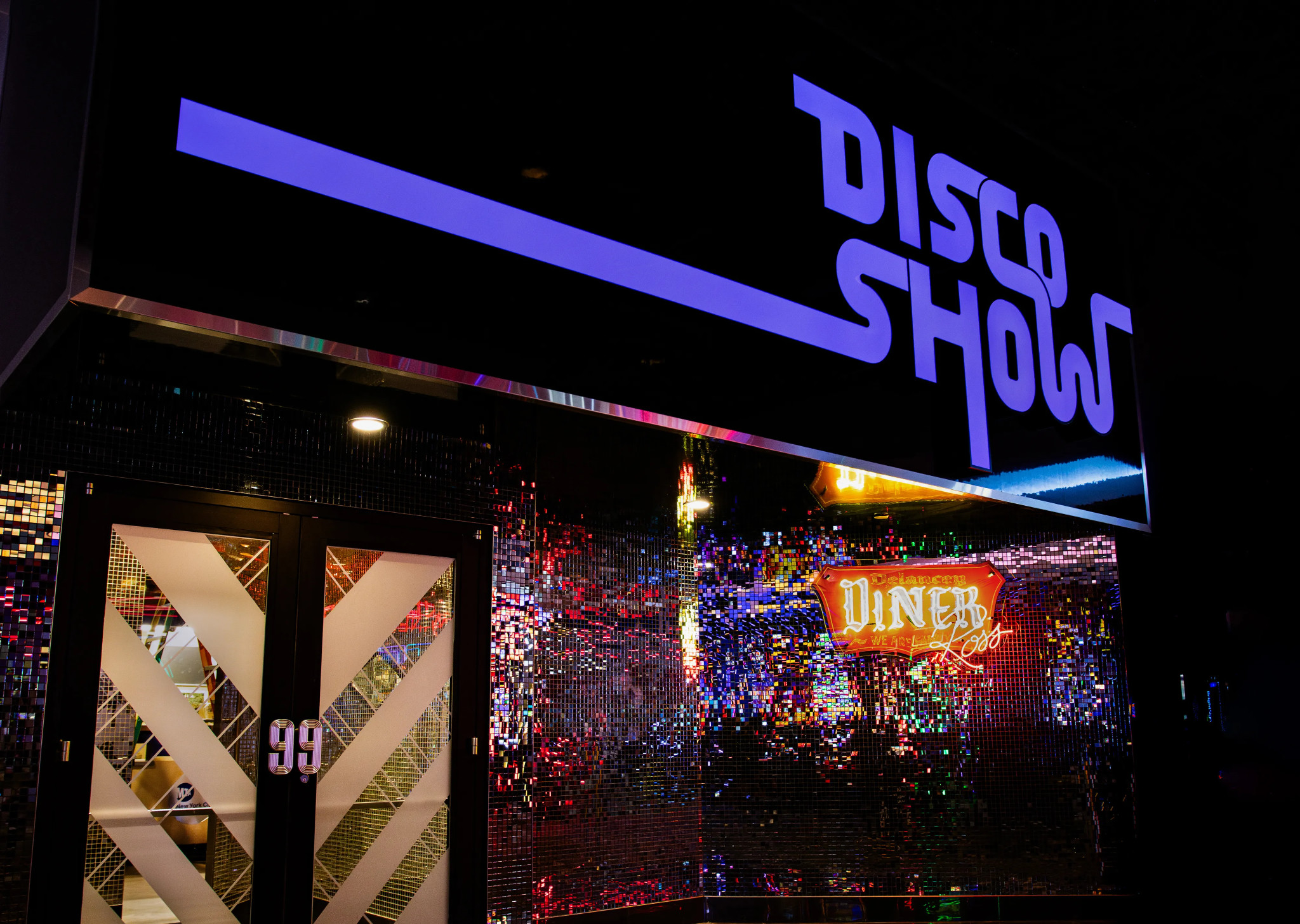 The DiscoShow entrance and illuminated Diner Ross sign at the LINQ.
