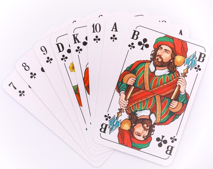 Fan of club-suit playing cards with German D, K and B indices and an illustrated Bube.