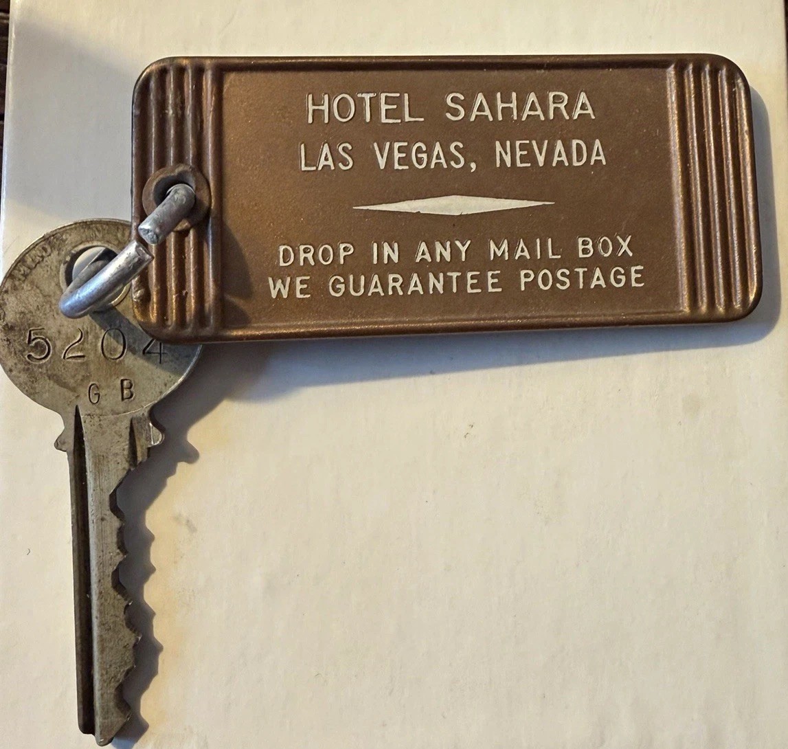 Hotel Sahara key and fob bearing the words Drop in any mail box. We guarantee postage.