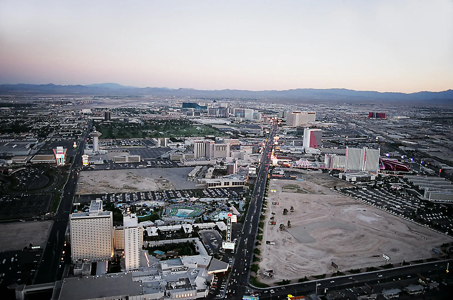 A southward view along the Strip in 1995, with the Sahara hotel at lower left and the broad vacant former El Rancho Vegas site across Las Vegas Boulevard at lower right.