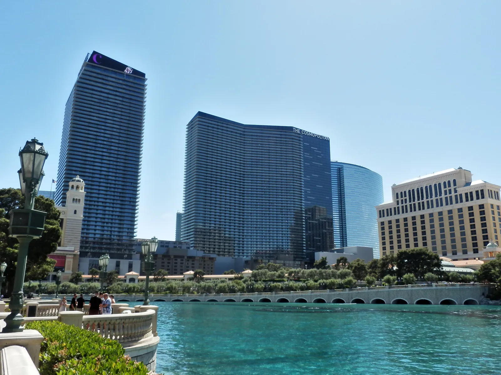 The Cosmopolitan’s two balcony-lined towers behind Bellagio’s lake in 2018, with separate Bellagio and Vdara buildings at right.