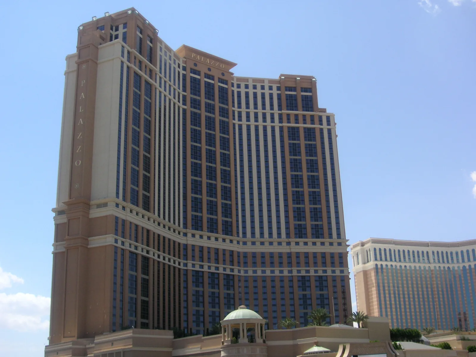 The Palazzo tower in daylight in 2009, with its low entrance dome below and part of The Venetian hotel at right.